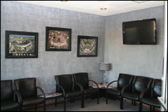 picture of a reception room with seating and a television