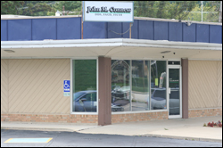 The front of the dental practice, showing windows and front door