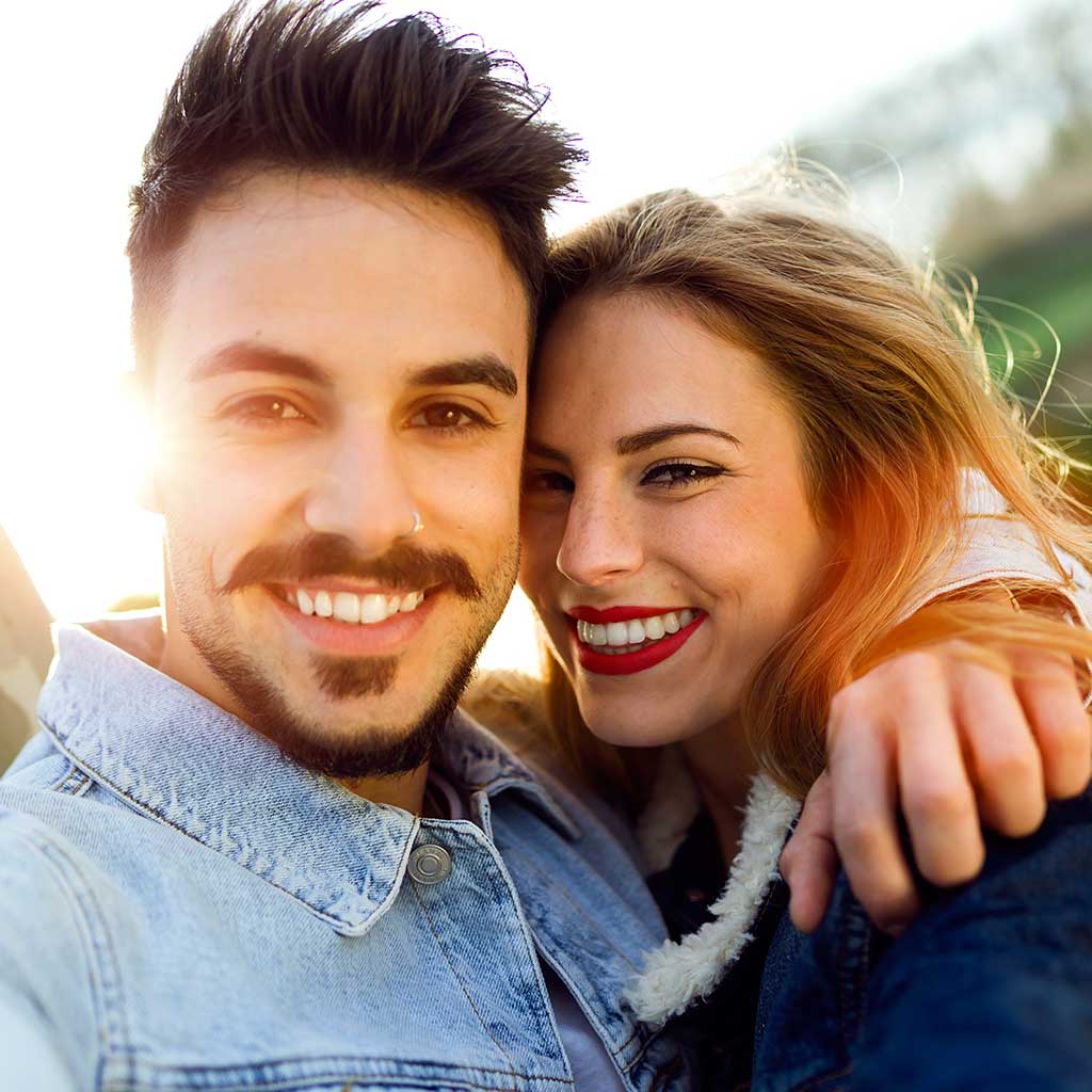 picture of young couple smiling at camera