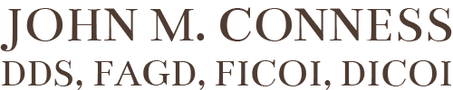 black logo of John M. Conness DDS, FAGD, FICOI, DICOI